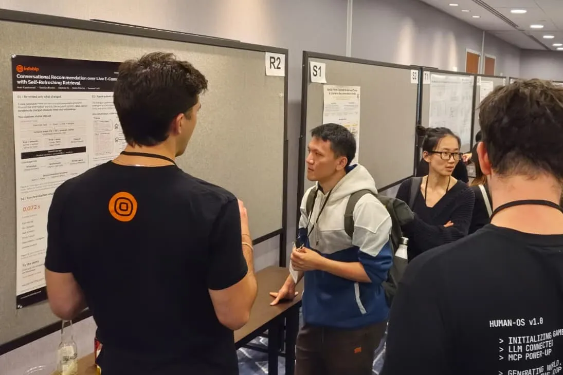 Infobip poster and demo session at RecSys 2026 in Minneapolis, with attendees gathered around the poster boards